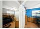 Hallway view with access to two bedrooms: one blue, one gray, both with closet space at 4629 Spottswood Dr, Orlando, FL 32812