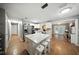 Spacious kitchen with an island and hardwood flooring, seamlessly connected to the living area for easy entertainment at 4629 Spottswood Dr, Orlando, FL 32812