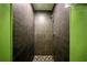 Modern shower featuring gray tile and a mosaic tile floor at 4629 Spottswood Dr, Orlando, FL 32812