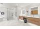 Spa-like bathroom with modern fixtures, dual vanities, and glass-enclosed shower at 4934 Legacy Oaks Dr, Orlando, FL 32839