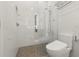 Bathroom with glass shower, handheld sprayer, and sleek, modern toilet at 4934 Legacy Oaks Dr, Orlando, FL 32839