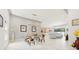 Bright, open-concept living space featuring modern tile flooring and stylish dining furniture at 4934 Legacy Oaks Dr, Orlando, FL 32839