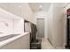 Modern laundry room with sleek white cabinetry, sink, and stainless steel washer and dryer units at 4934 Legacy Oaks Dr, Orlando, FL 32839