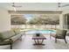Relaxing screened-in patio with comfortable seating overlooking a sparkling pool at 4934 Legacy Oaks Dr, Orlando, FL 32839