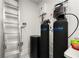Utility room with water filtration systems, ladder, and modern control panel at 4934 Legacy Oaks Dr, Orlando, FL 32839