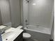 Bright bathroom featuring white tile, modern fixtures, a shower, and a bathtub at 5101 Prairie Preserve Run, St Cloud, FL 34772