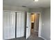 Bedroom showcases carpeting and ensuite bathroom with closet at 5101 Prairie Preserve Run, St Cloud, FL 34772