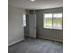 Bedroom showcasing new carpet and an exterior view of a lake at 5101 Prairie Preserve Run, St Cloud, FL 34772