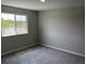 Bright bedroom with a large window overlooking a pond at 5101 Prairie Preserve Run, St Cloud, FL 34772