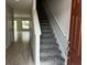 Inviting foyer with a staircase leading to the upper level at 5101 Prairie Preserve Run, St Cloud, FL 34772