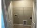 Interior shot of a laundry room showcasing hookups and shelving at 5101 Prairie Preserve Run, St Cloud, FL 34772