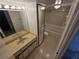 Updated bathroom featuring modern vanity with full mirror and bathtub at 5288 Cypress Ct # 439, Orlando, FL 32811