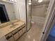 Updated bathroom featuring modern vanity with full mirror and bathtub at 5288 Cypress Ct # 439, Orlando, FL 32811
