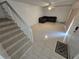 Bright living room with tile floors, staircase, and comfortable seating area at 5288 Cypress Ct # 439, Orlando, FL 32811