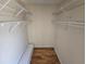 Walk-in closet with built in shelving and wood floor at 5288 Cypress Ct # 439, Orlando, FL 32811