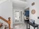 Bright foyer with a decorative glass front door and a view into the dining room at 5365 Rocking Horse Pl, Oviedo, FL 32765
