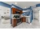 Open kitchen with stainless steel appliances, granite countertops, and seamless flow into the living area at 5365 Rocking Horse Pl, Oviedo, FL 32765