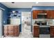 Gourmet kitchen with stainless appliances, custom cabinetry, and seamless connection to the living space at 5365 Rocking Horse Pl, Oviedo, FL 32765