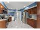 Spacious kitchen with stainless steel appliances, ample counter space, and stylish backsplash at 5365 Rocking Horse Pl, Oviedo, FL 32765