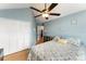 Comfortable bedroom featuring a large bed, closet, and an ensuite bathroom at 5365 Rocking Horse Pl, Oviedo, FL 32765