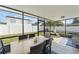 Spacious screened-in porch with dining area, seating, and views of the backyard at 5365 Rocking Horse Pl, Oviedo, FL 32765