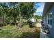 A spacious backyard offers great potential for outdoor activities and gardening, featuring a utility shed at 540 W Columbia St, Lake Alfred, FL 33850