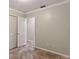 Bedroom featuring neutral walls, tiled floors, and closet, perfect for a cozy retreat at 540 W Columbia St, Lake Alfred, FL 33850