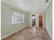 Bright bedroom with an ensuite bathroom and closet access providing convenience and privacy at 540 W Columbia St, Lake Alfred, FL 33850