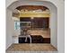 Stylish kitchen showcasing granite countertops, stainless steel appliances, and dark wood cabinets at 540 W Columbia St, Lake Alfred, FL 33850