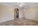 Spacious living room with tile floors and easy access to the kitchen featuring stainless steel appliances at 540 W Columbia St, Lake Alfred, FL 33850