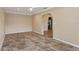 This airy living room features tiled floors and an archway that flows seamlessly into other rooms at 540 W Columbia St, Lake Alfred, FL 33850
