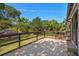 Back deck with wood railing overlooking a yard with trees and a view of the surrounding landscape at 5420 Lido St, Orlando, FL 32807