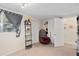 Bright bedroom featuring a large window, shelving and a cozy hanging chair for relaxing at 5420 Lido St, Orlando, FL 32807