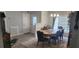 Dining room with modern flooring, updated lighting fixtures, and access to other rooms at 6026 Canyon De Chelley Ct, Orlando, FL 32810