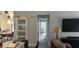 Open-concept living room adjacent to dining area, featuring modern design and natural light at 6026 Canyon De Chelley Ct, Orlando, FL 32810