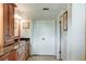 Bathroom featuring tile floors, granite countertops, and custom cabinets with a large linen closet at 680 Cheoy Lee Cir, Winter Springs, FL 32708
