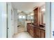 Elegant bathroom featuring tile floors, granite countertops, custom cabinets, and a glass enclosed shower at 680 Cheoy Lee Cir, Winter Springs, FL 32708
