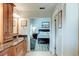 Bathroom with granite countertops, custom cabinets with a linen closet, and access to the main bedroom at 680 Cheoy Lee Cir, Winter Springs, FL 32708