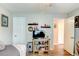 Bedroom includes wood floors, ceiling fan, TV, shelving, and closet at 680 Cheoy Lee Cir, Winter Springs, FL 32708
