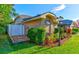 Well-maintained home exterior with landscaped yard, brick accents, and a charming lamp post at 680 Cheoy Lee Cir, Winter Springs, FL 32708