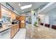 Bright kitchen boasts granite countertops, stainless appliances, and a large island with seating at 680 Cheoy Lee Cir, Winter Springs, FL 32708