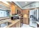 Well-equipped kitchen featuring granite countertops, stainless steel appliances, and ample cabinet space at 680 Cheoy Lee Cir, Winter Springs, FL 32708