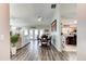 Spacious living area featuring stylish laminate floors, a ceiling fan, and an adjacent dining room at 680 Cheoy Lee Cir, Winter Springs, FL 32708