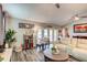 Bright living room boasts hardwood floors and comfortable seating with access to outdoor space at 680 Cheoy Lee Cir, Winter Springs, FL 32708