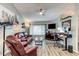 Comfortable living space features wood floors and an open layout perfect for entertaining or relaxing at 680 Cheoy Lee Cir, Winter Springs, FL 32708