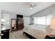 Bright main bedroom with a ceiling fan, vaulted ceilings and a dresser with a television at 680 Cheoy Lee Cir, Winter Springs, FL 32708
