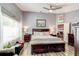 The main bedroom features laminate floors, a ceiling fan, and abundant natural light at 680 Cheoy Lee Cir, Winter Springs, FL 32708