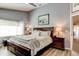 Comfortable main bedroom featuring neutral walls, plush bedding, and dark wood furniture at 680 Cheoy Lee Cir, Winter Springs, FL 32708