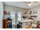 Bright office space complete with craft and sewing tables, hardwood floors, with a view of the pool at 680 Cheoy Lee Cir, Winter Springs, FL 32708