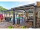 Large screened-in pool and patio featuring an outdoor kitchen and multiple seating areas for entertaining at 680 Cheoy Lee Cir, Winter Springs, FL 32708